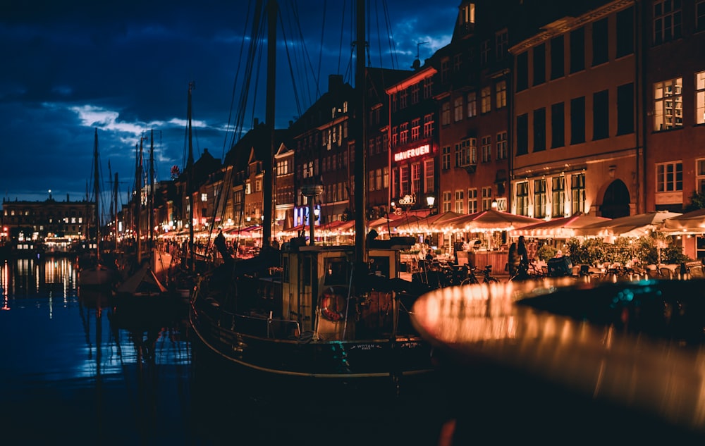 a boat in a canal between buildings