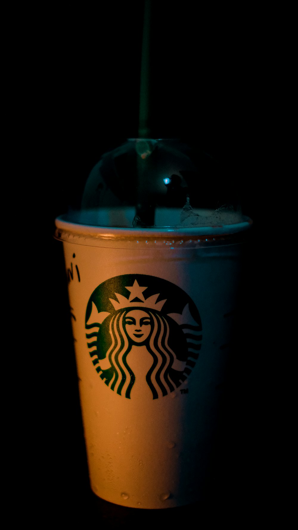 a cup with a straw