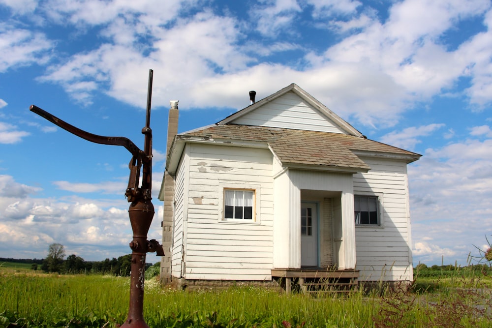 a house with a windmill in front of it