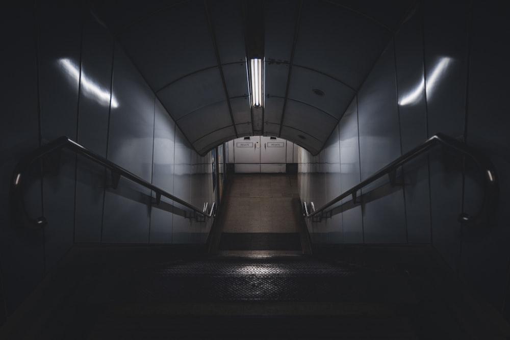 a dark hallway with white walls