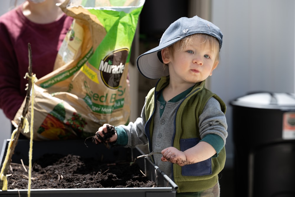 a child holding a bag of food