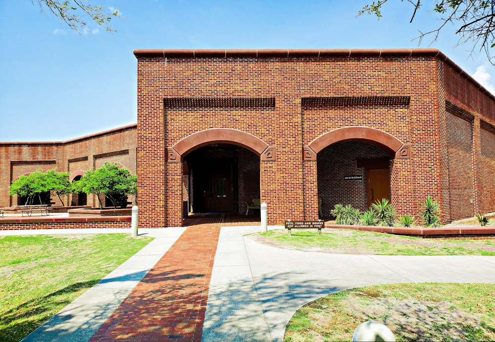 a brick building with a walkway