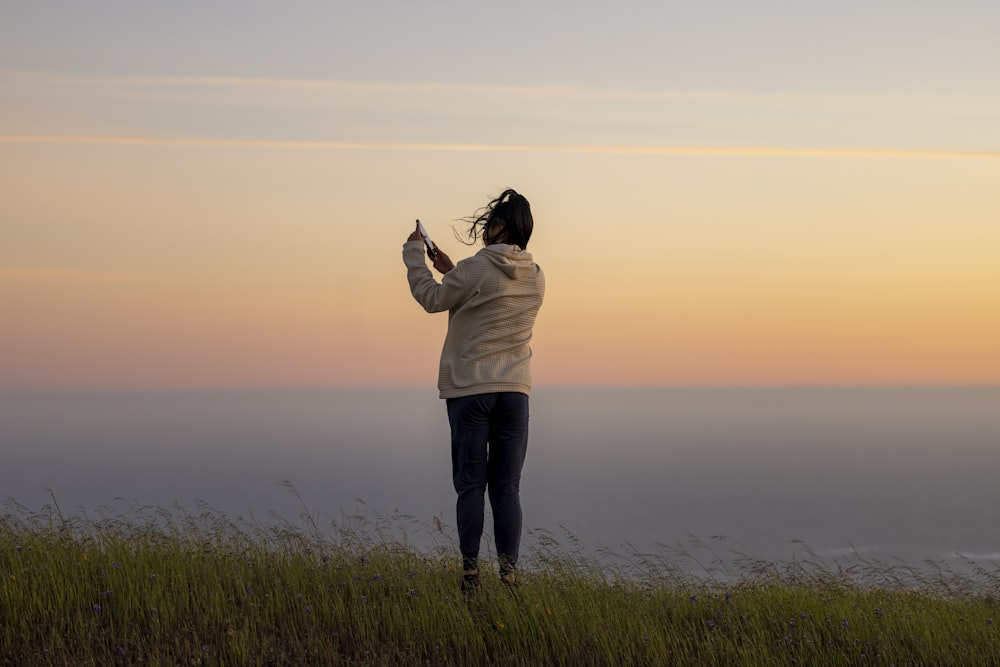 a person standing on a hill