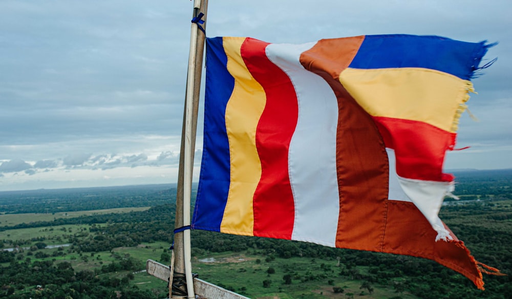 a couple of flags on a pole