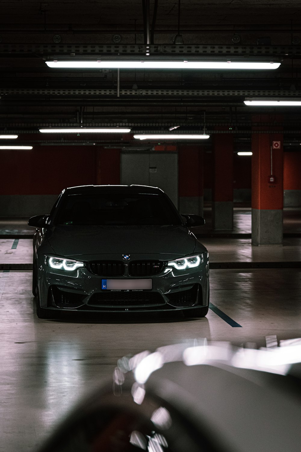 a bmw car parked in a parking garage