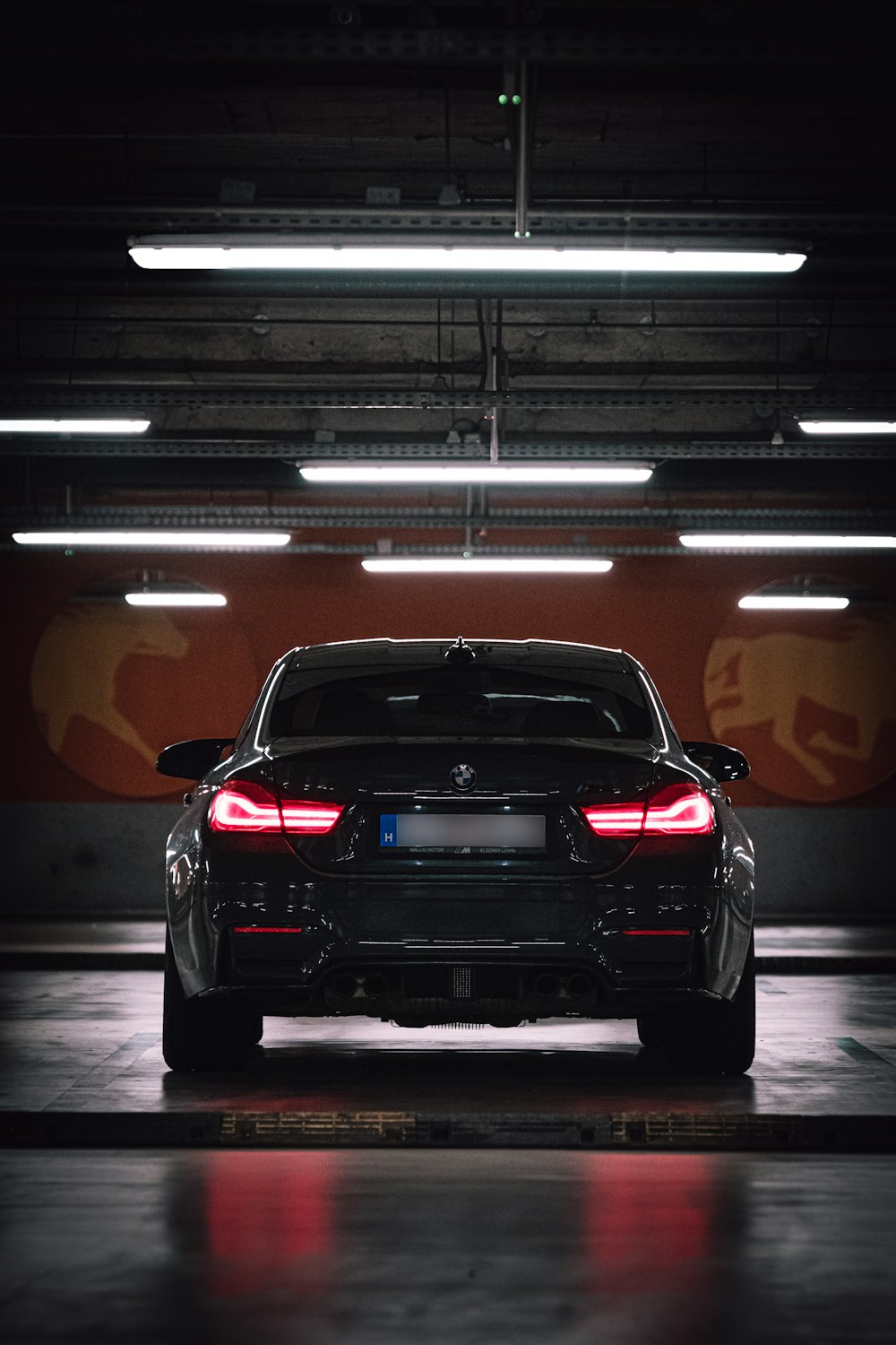 a black car parked in a garage