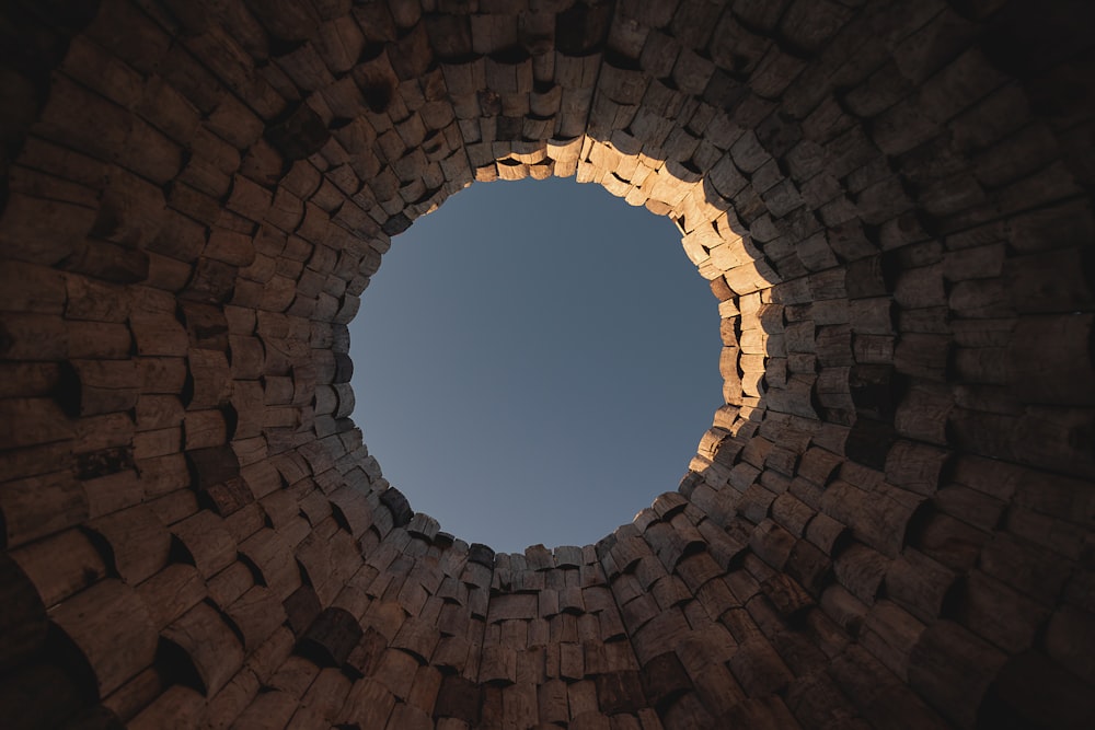 a stone archway with a hole in it