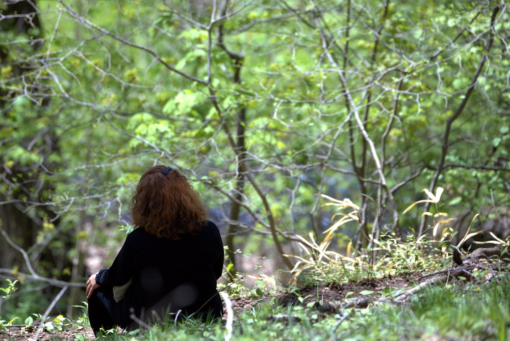 a person sitting in the woods