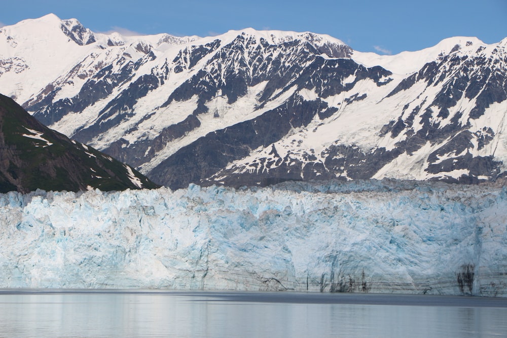 a snowy mountain range with Glacier Bay National Park and Preserve in the background