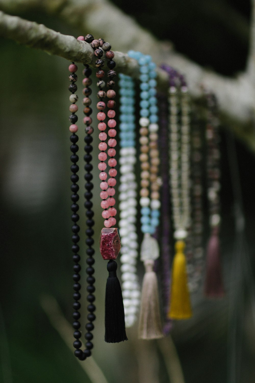 a close-up of several necklaces