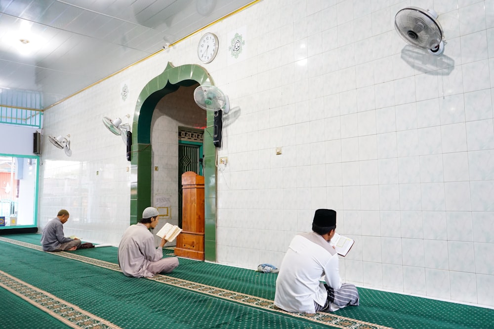 men sitting on the floor