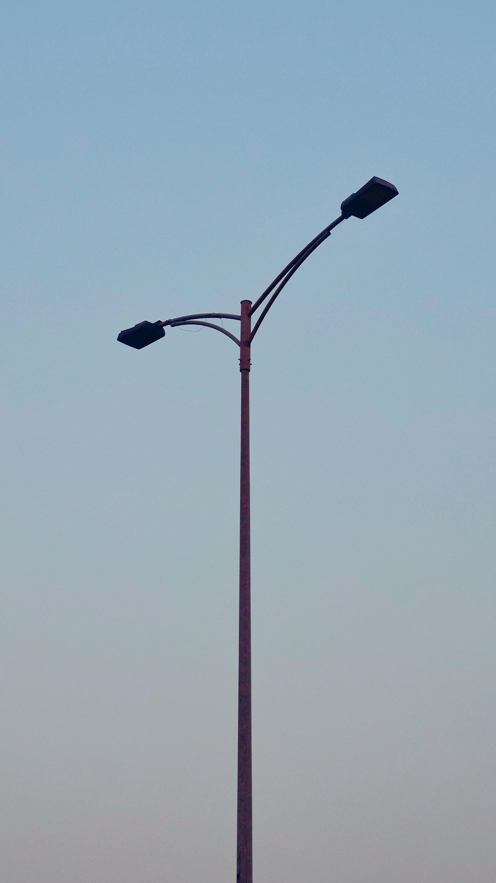 a street light with a blue sky