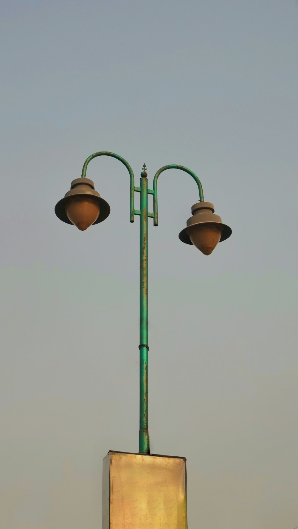 a light post with a couple of light bulbs on top
