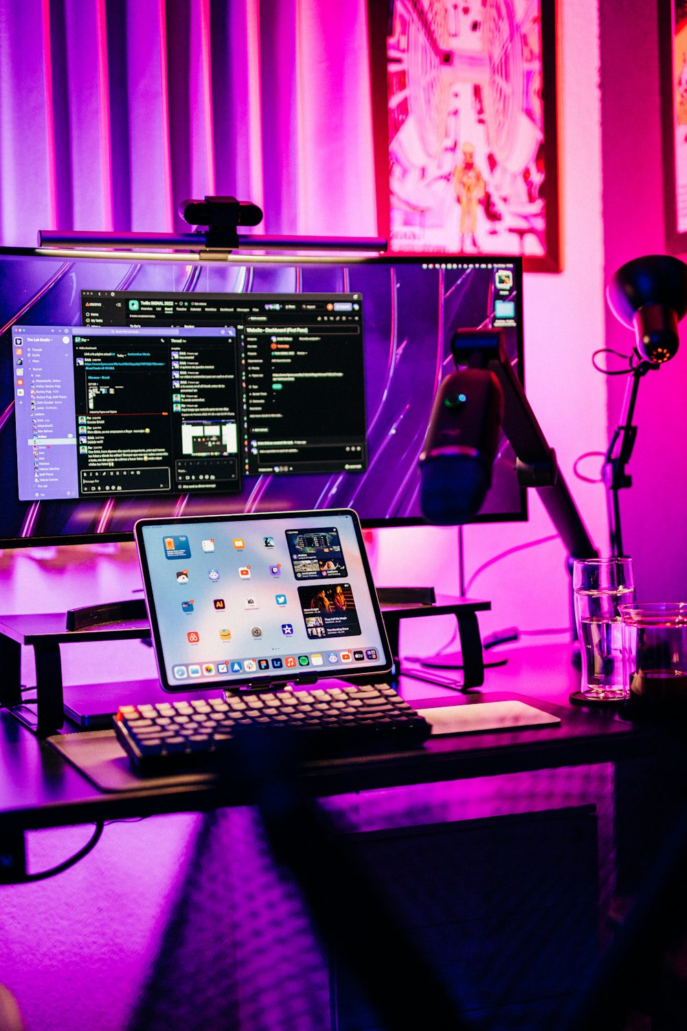 a desk with a computer and a keyboard on it