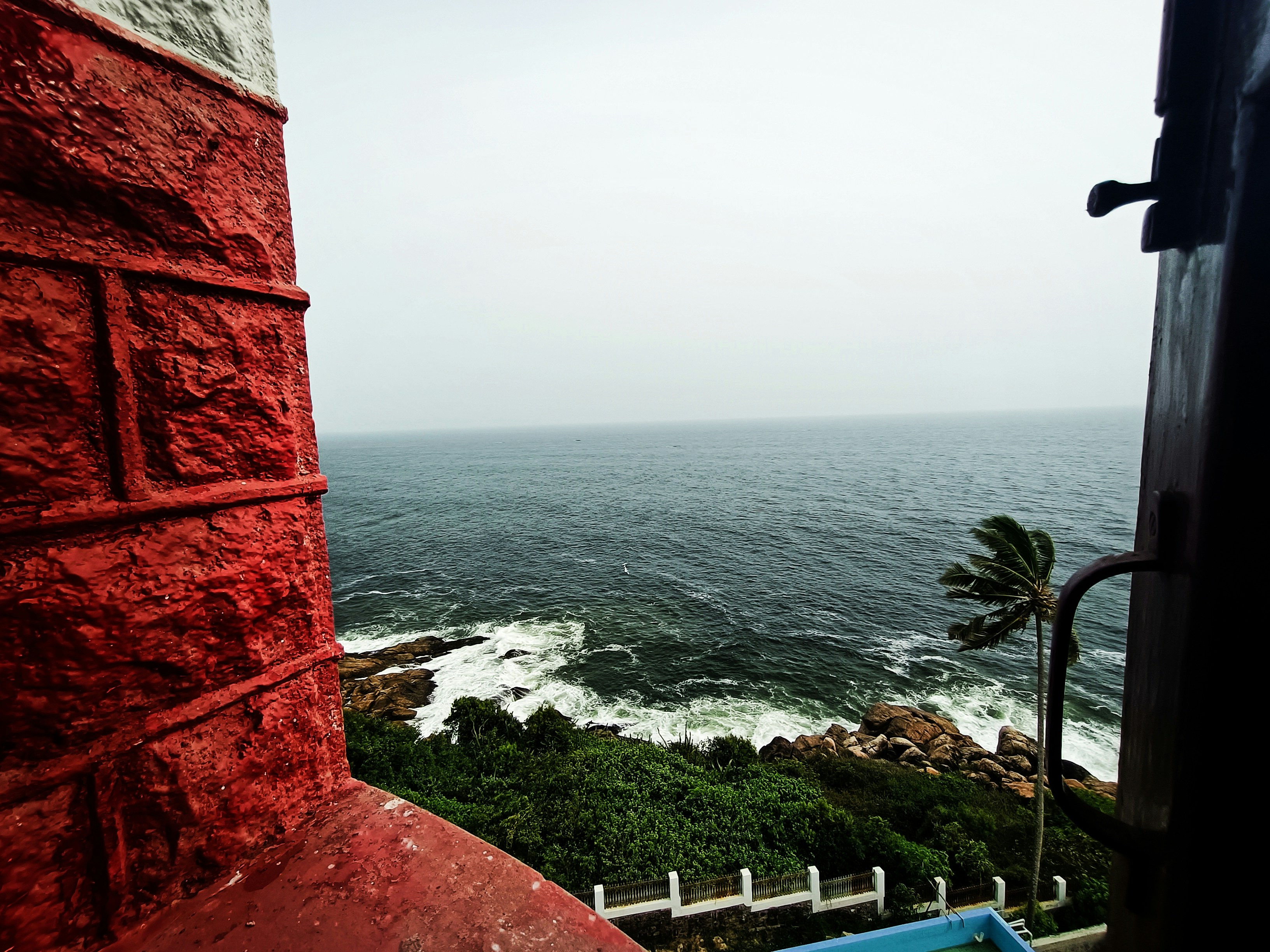 a red building overlooking a body of water