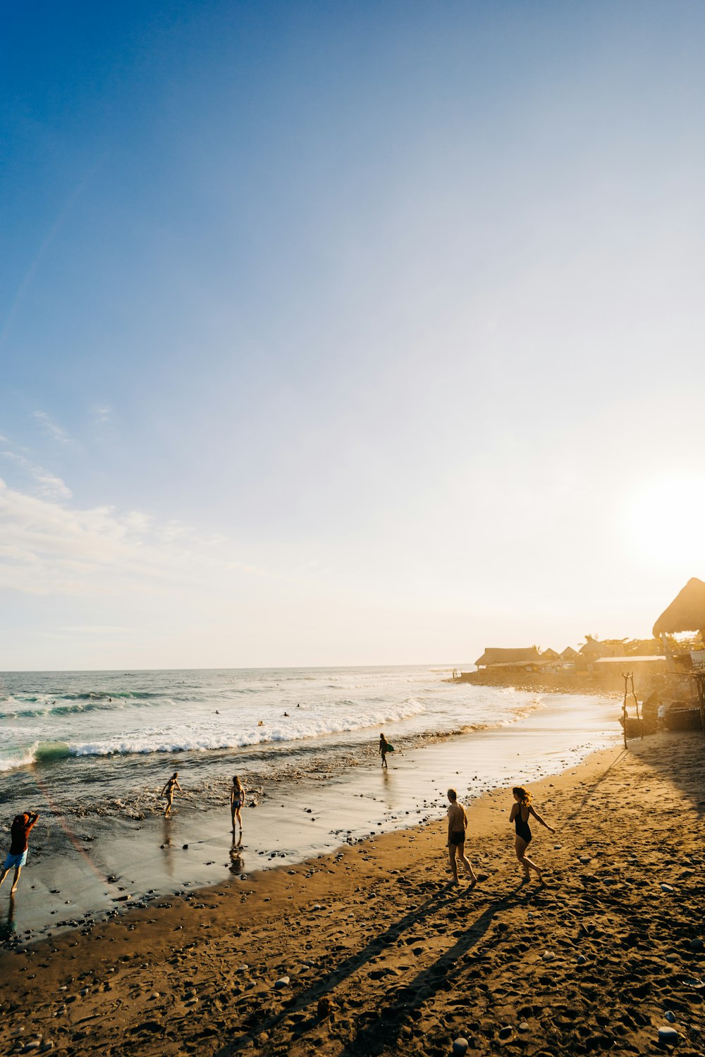 people walking on a beach