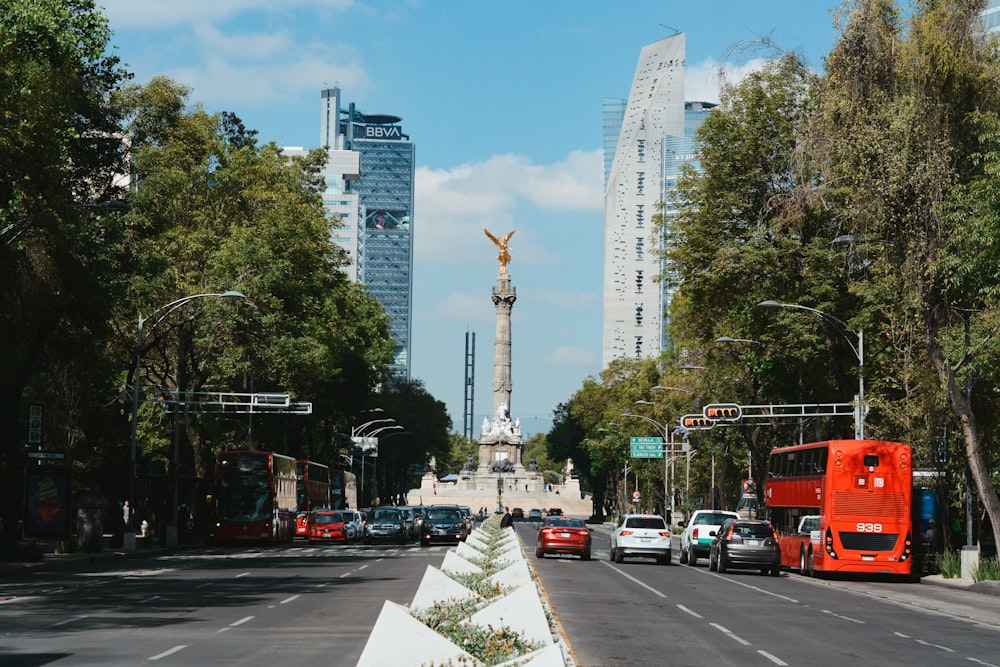 a city street with a monument in the background