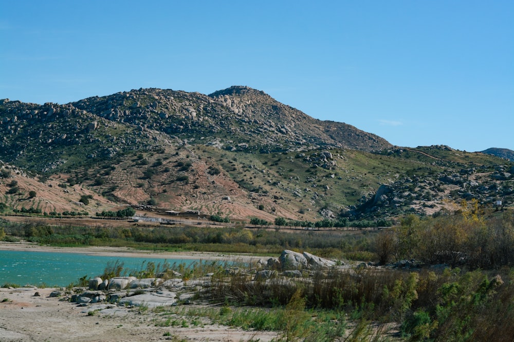 a lake in front of a mountain