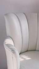 Close-up of a clean, freshly treated upholstered chair in a bright room.