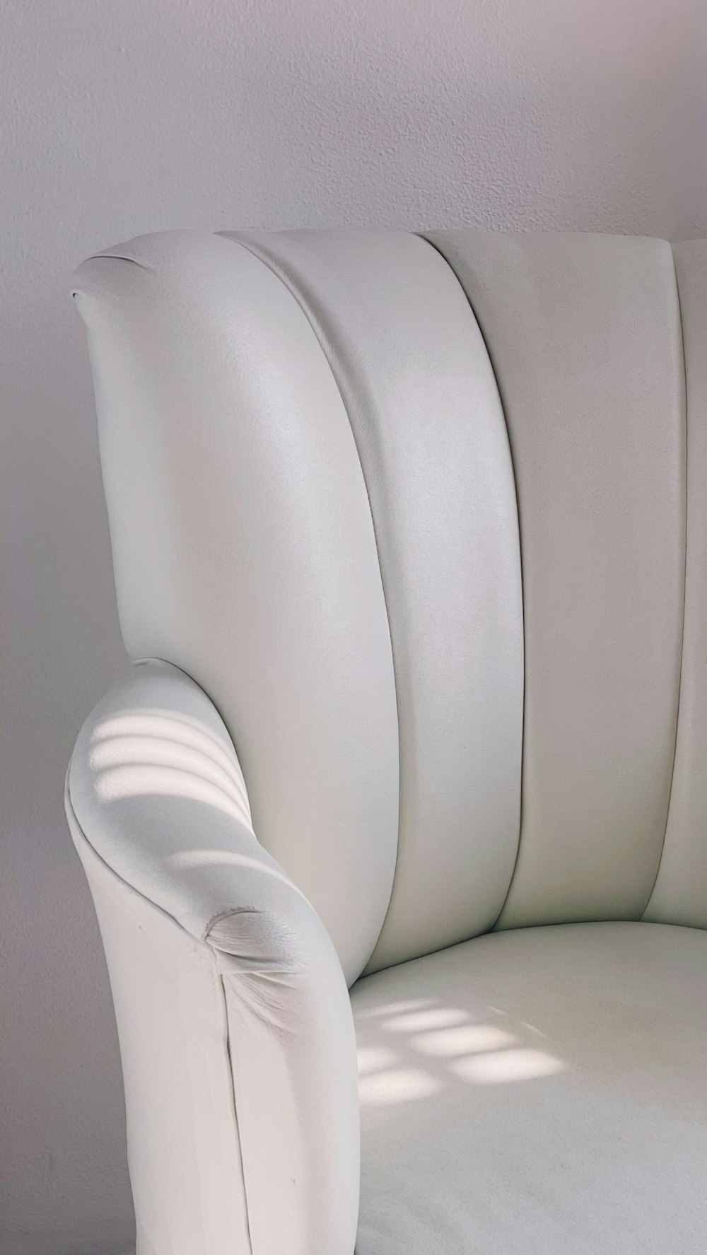 a white chair with a cushion