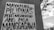 A wall with a poster in black and white text written in the Filipino language. In the background, there is an outdoor scene with utility lines, a tree, and a partly cloudy sky.