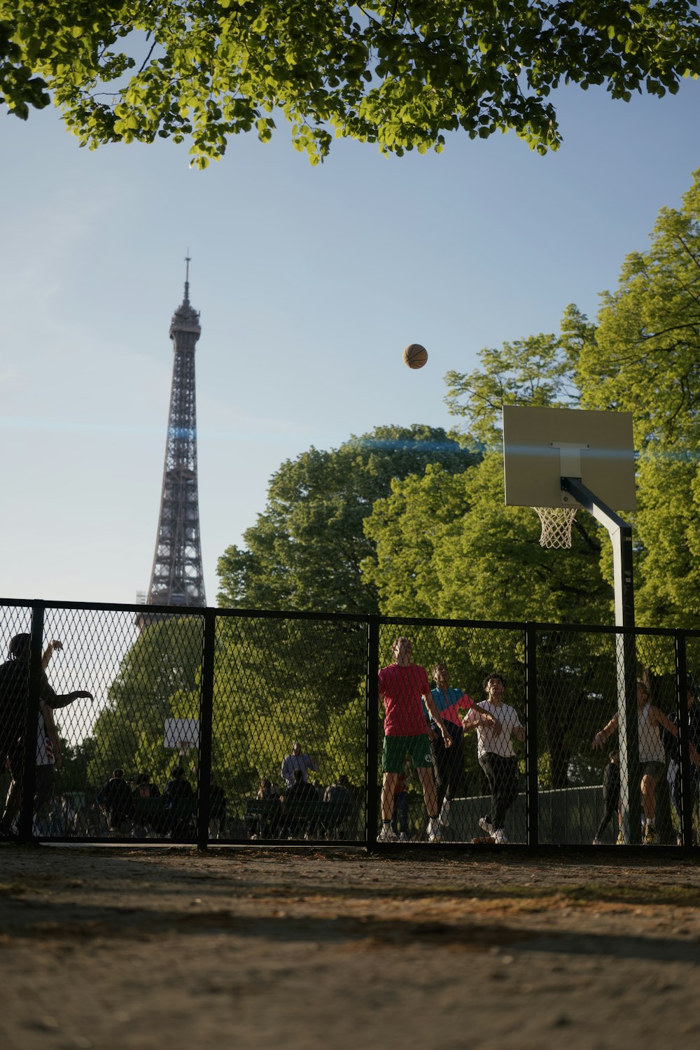 a group of people playing basketball