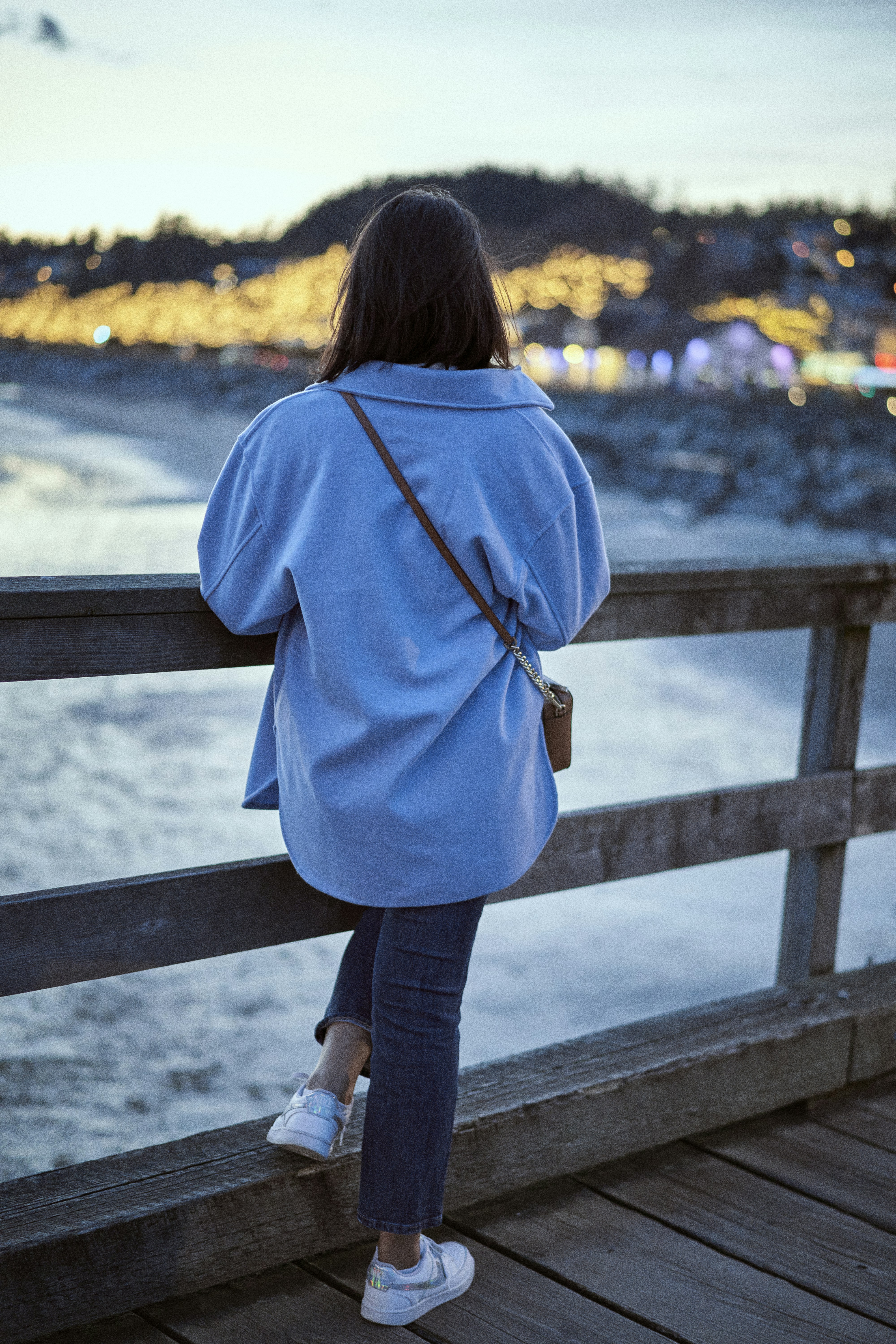 a person standing on a bridge