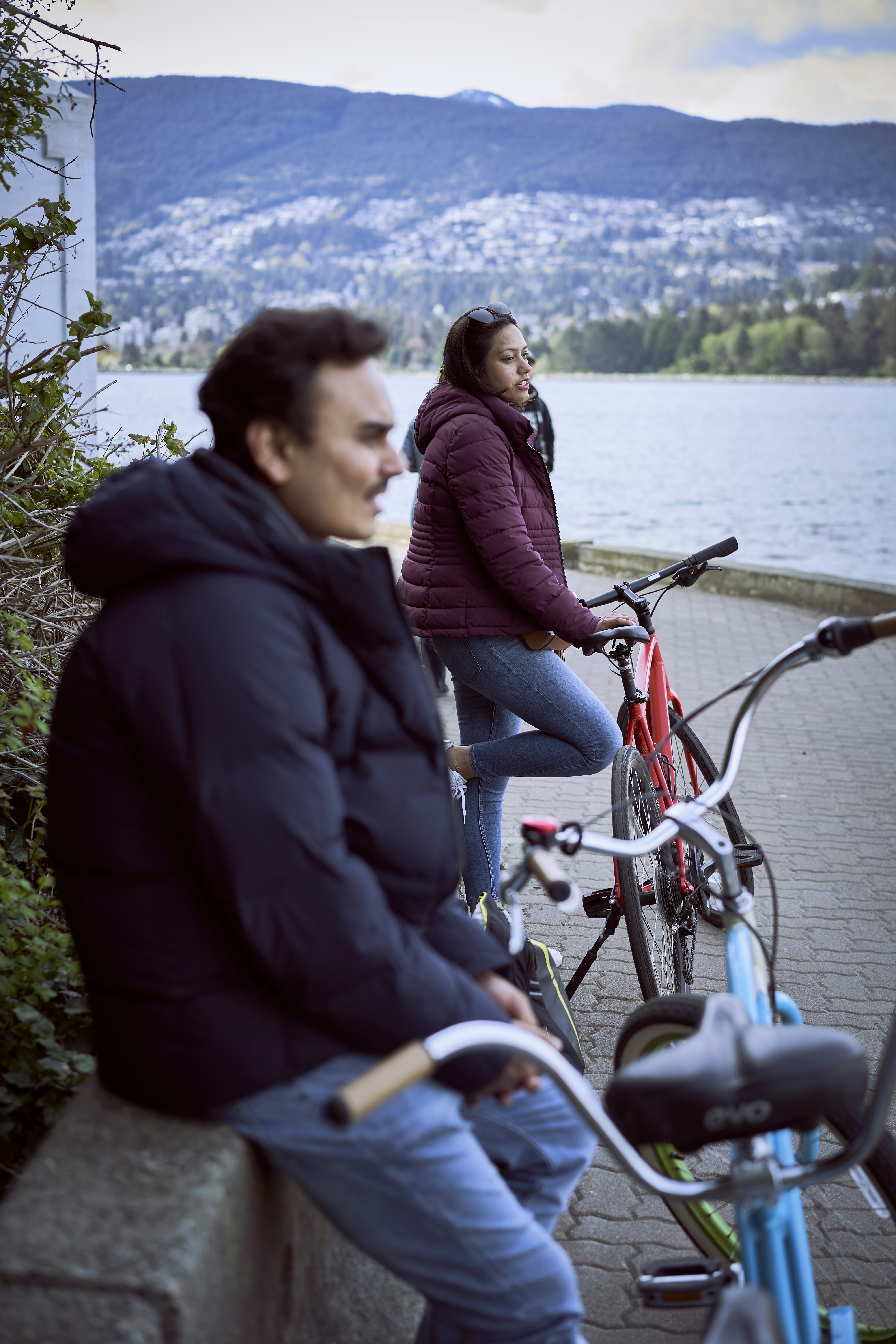 a man and woman riding bikes