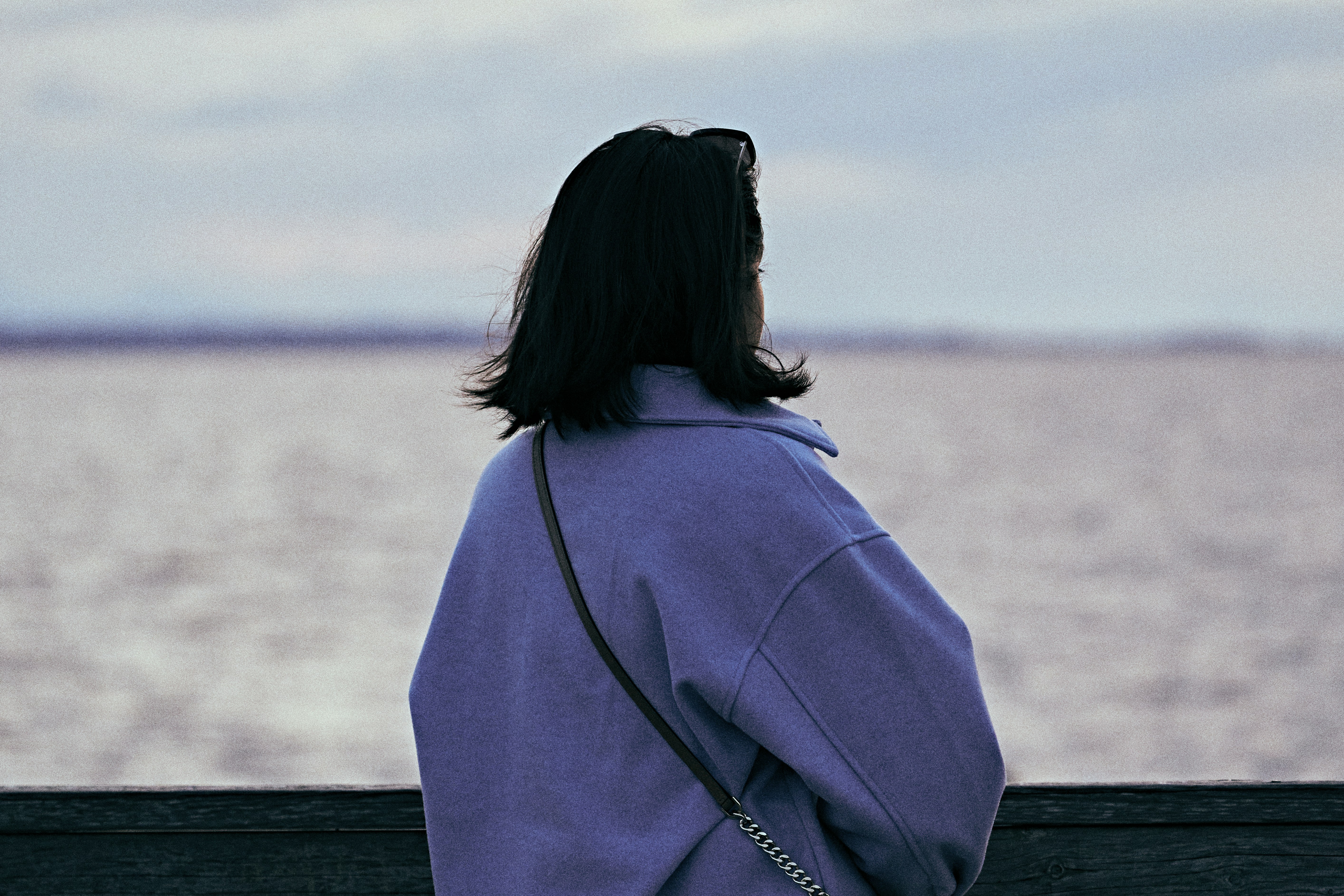 Person looking thoughtfully at the horizon, representing mental health reflection - mental health support Florida