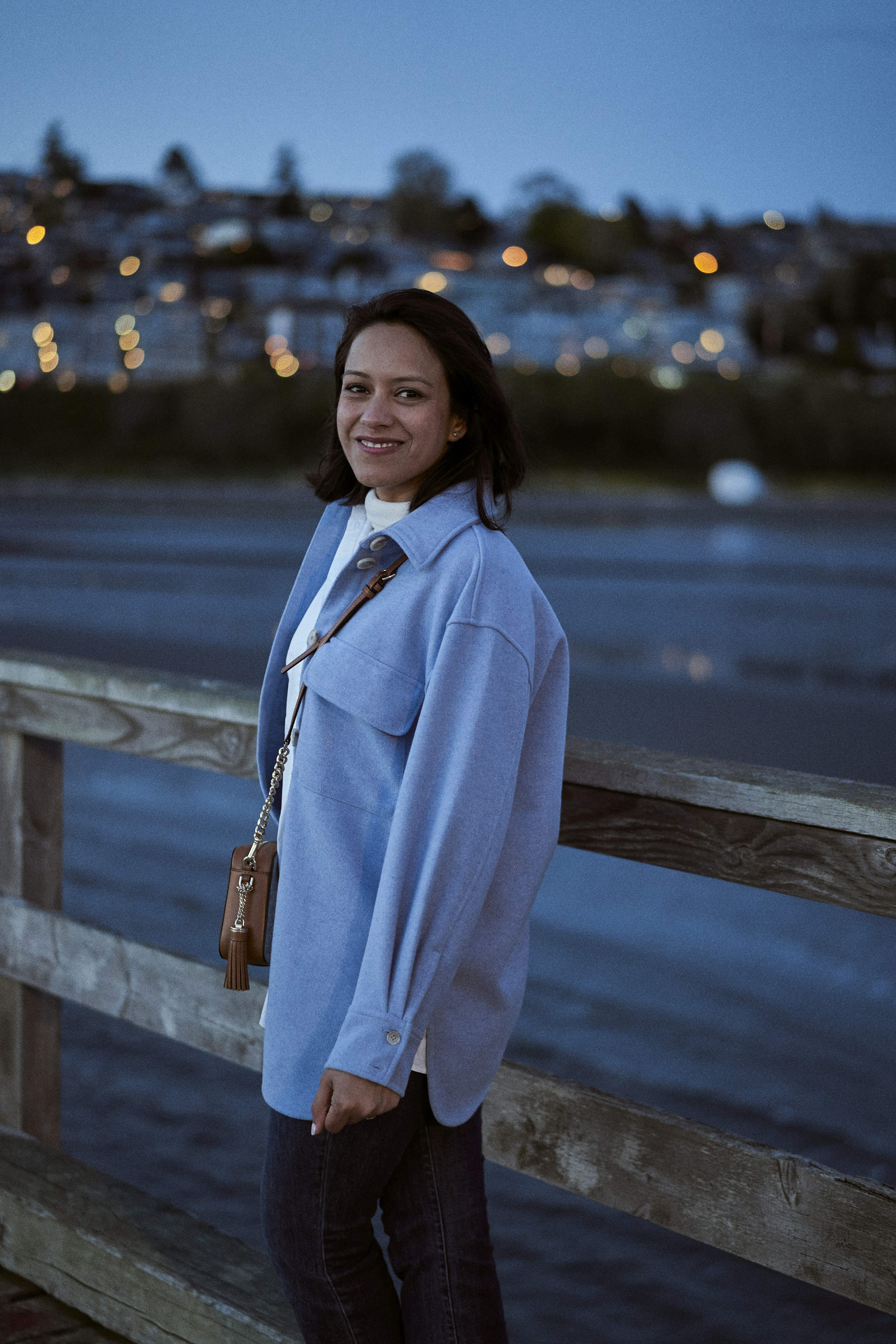 a person standing on a bridge
