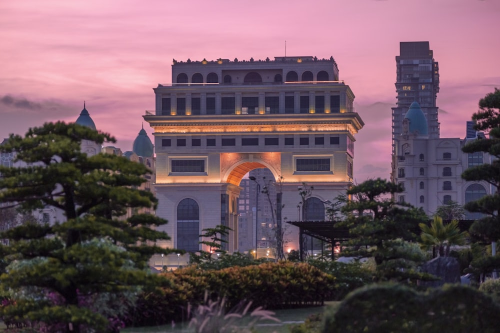 a large building with trees in front of it