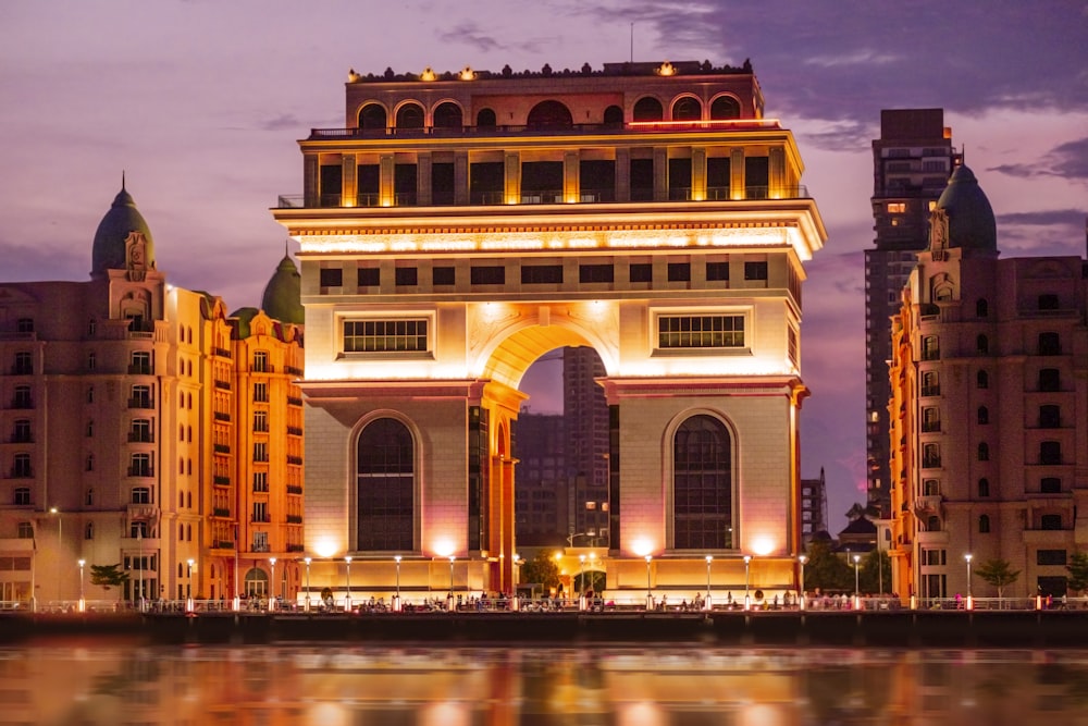 a large building with a bridge over water