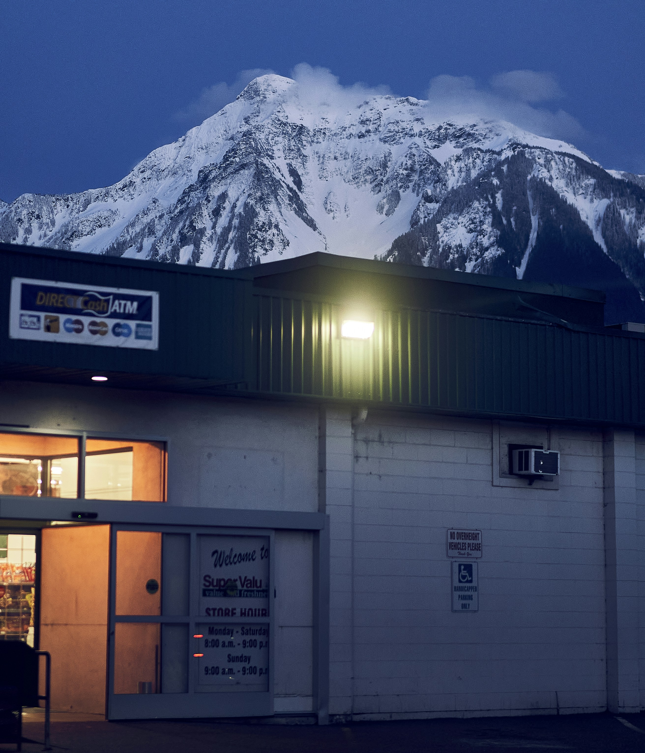 a building with a mountain in the background