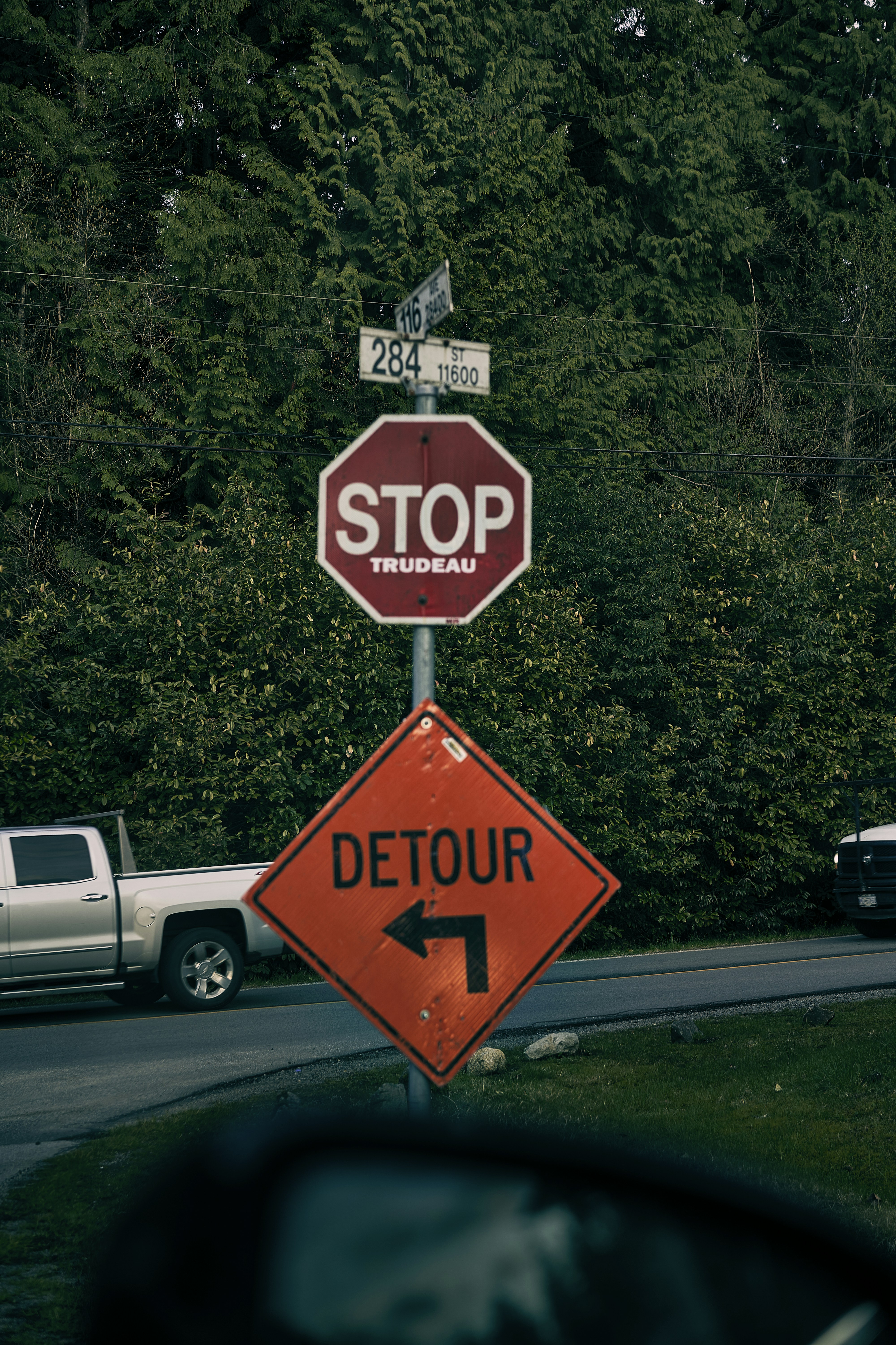 a stop sign with a sticker on it