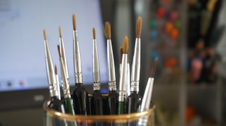 a group of pens in a holder