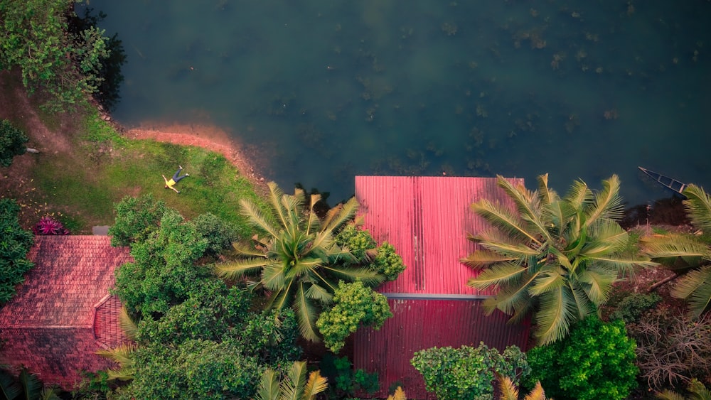 a red building surrounded by trees