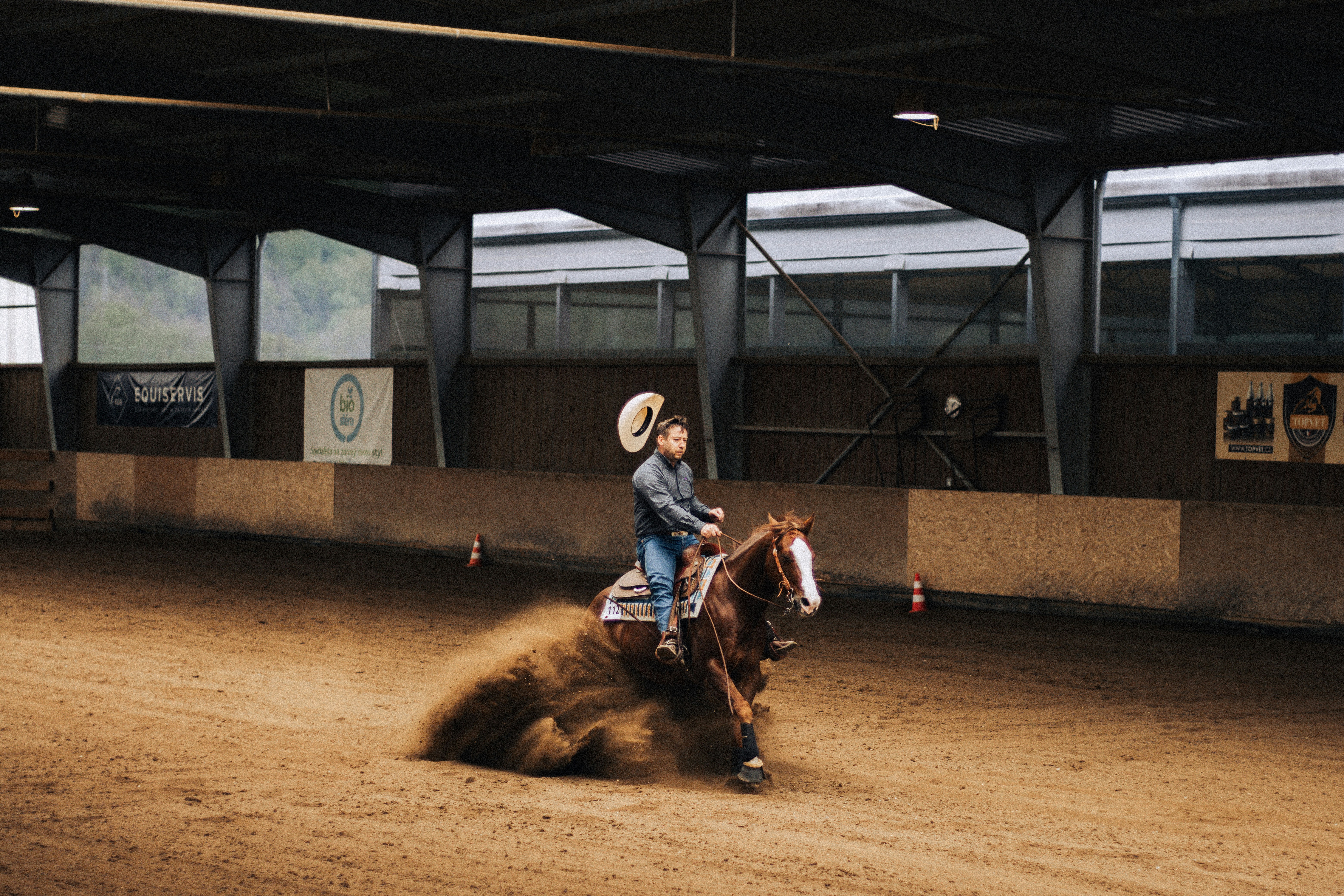 A man riding a horse on a dirt track photo – Free Person Image on Unsplash