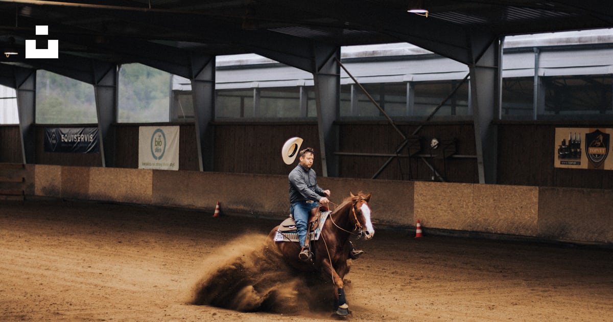 A man riding a horse on a dirt track photo – Free Person Image on Unsplash