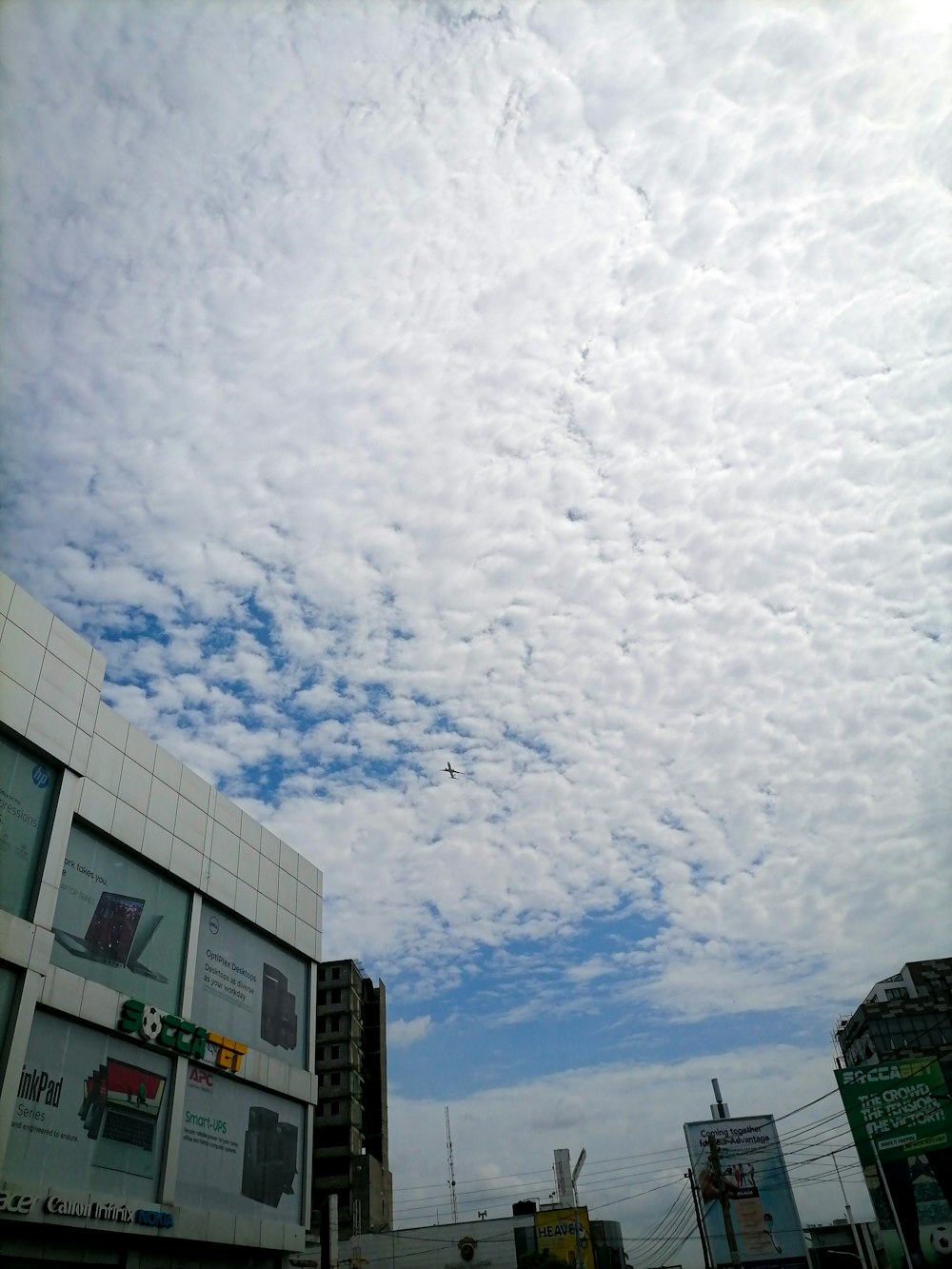 a group of buildings with clouds above