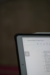 A digital device displaying meeting notes dated March 7, 2022. The text is in a list format, and the screen shows formatting options like bold and italic.