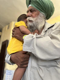 A warm image of a happy Indian family in Sultanpur, symbolizing trust and protection.