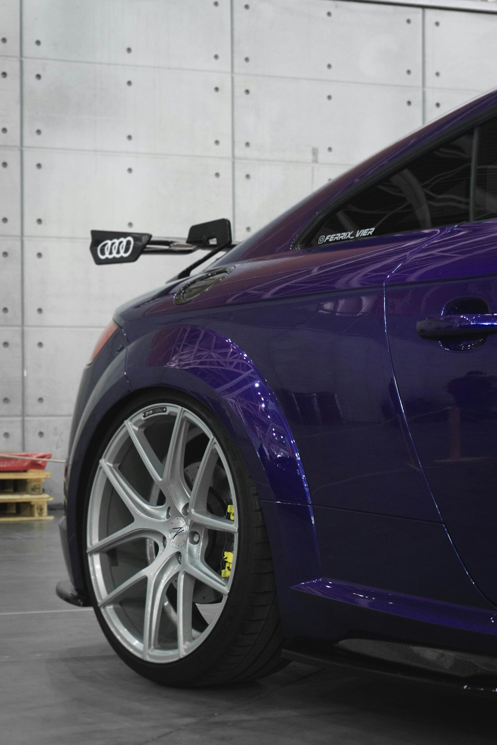 a purple car with a black rim
