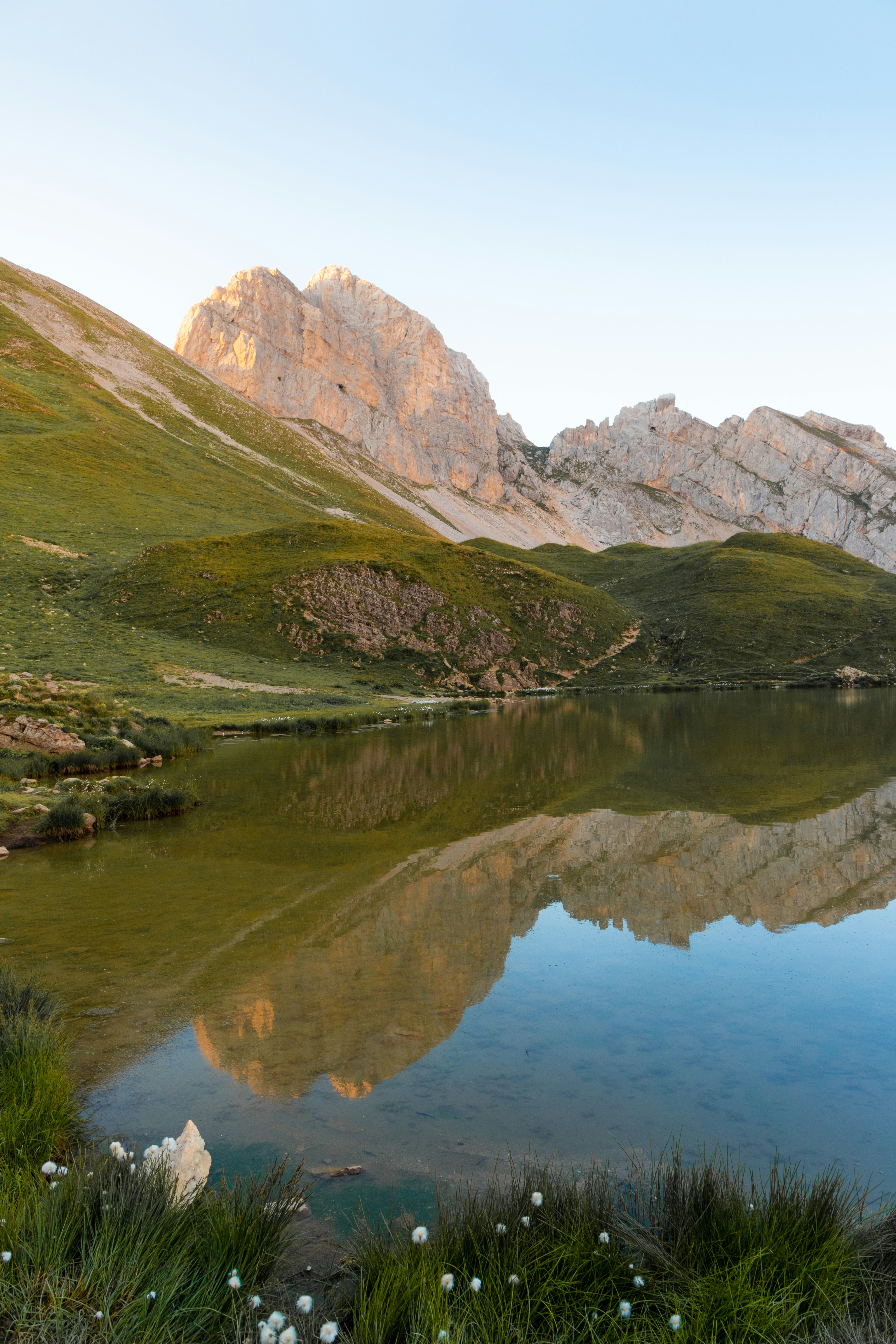 Reflections in Lac de Peyre's water in French Alps at sunset