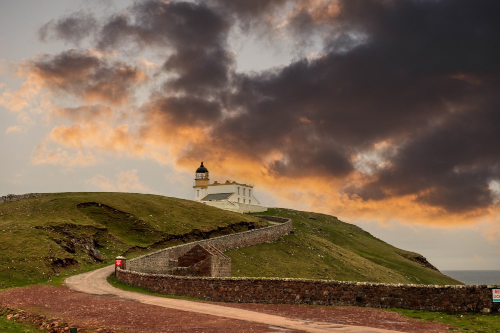 a lighthouse on a hill