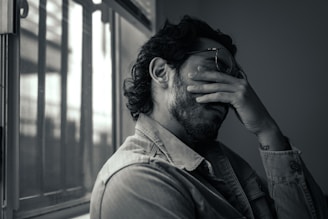 a man with a beard and glasses
