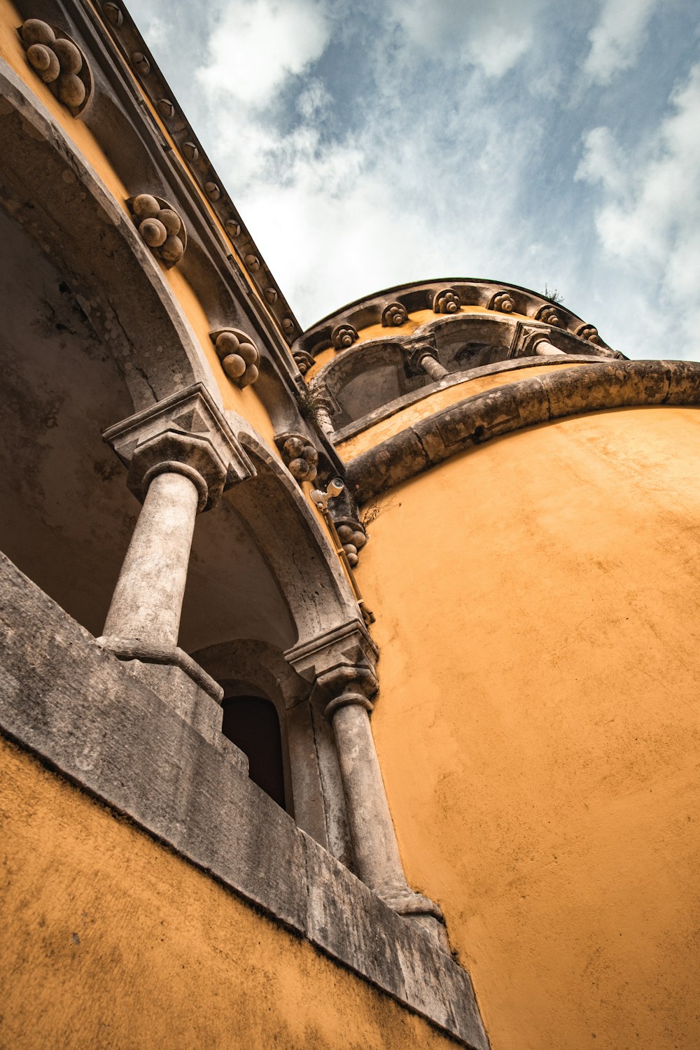 a large gold and black building