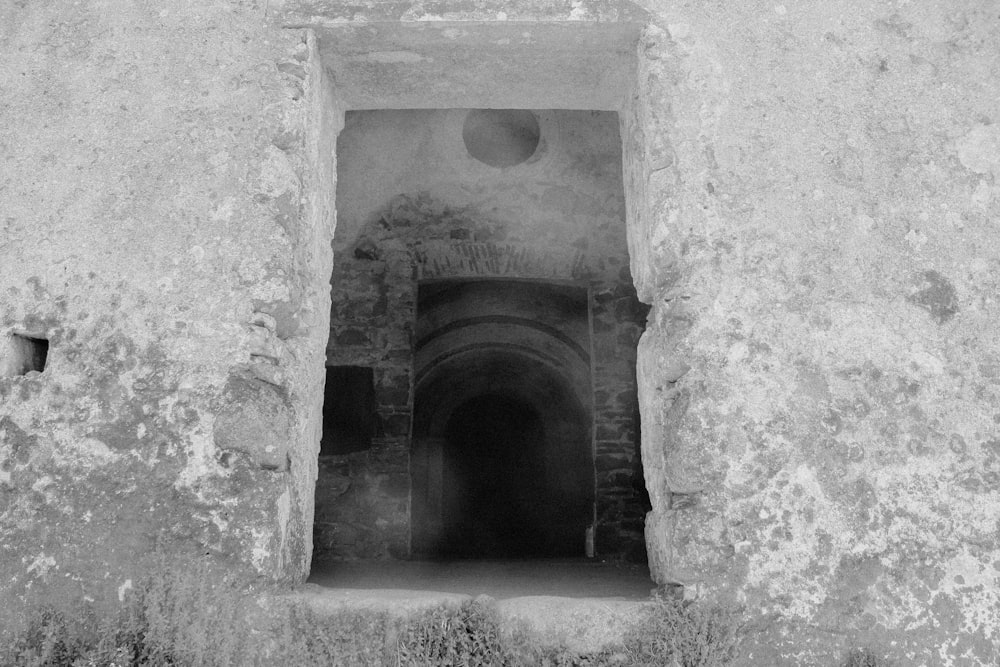 a stone tunnel with a door