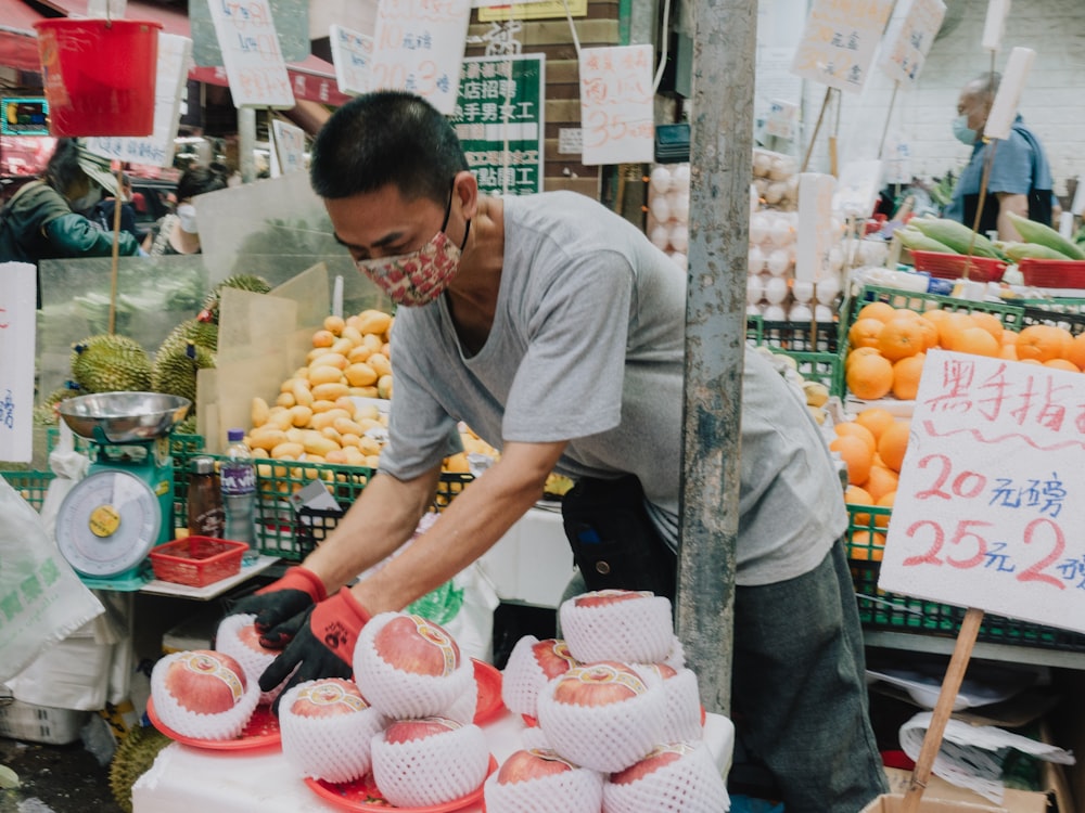 a person cutting a cupcake