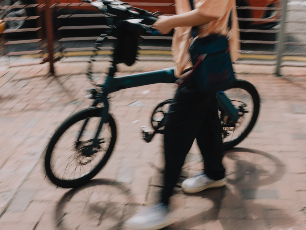 a person walking a bicycle