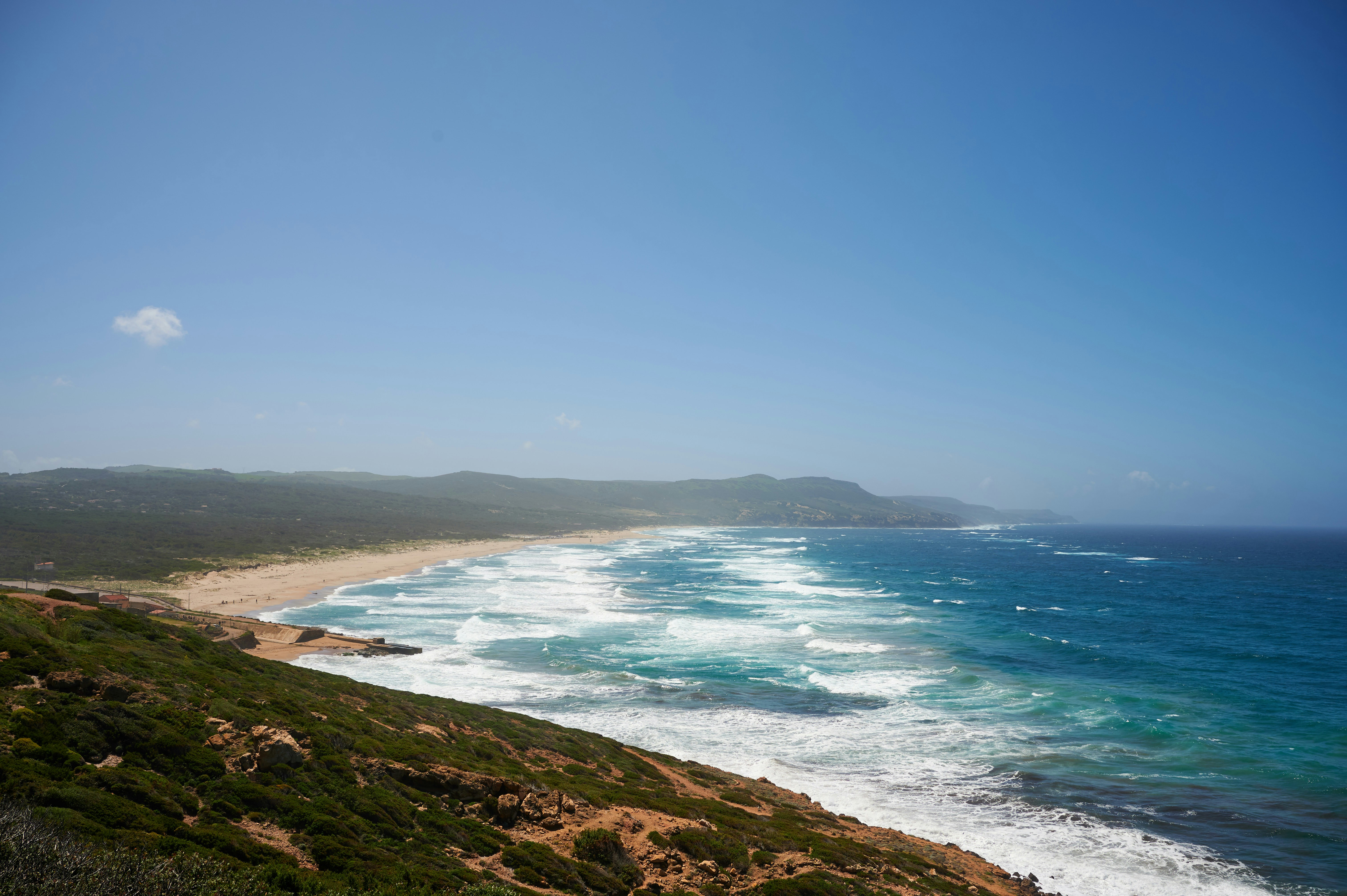 a beach with waves crashing on it